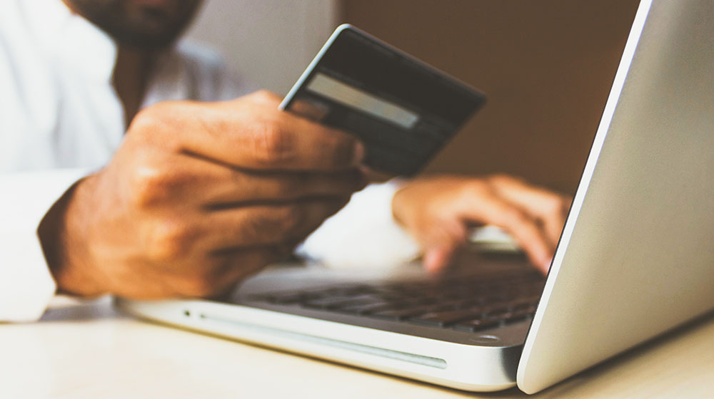 Man banking online with laptop.