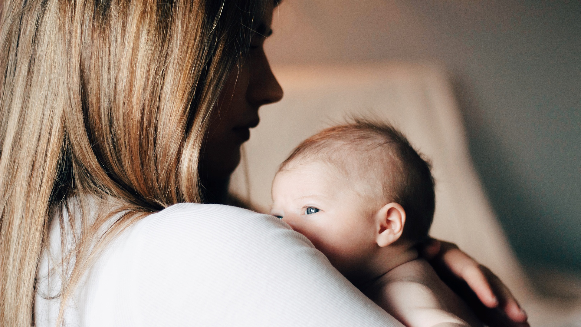 A mother holding her infant