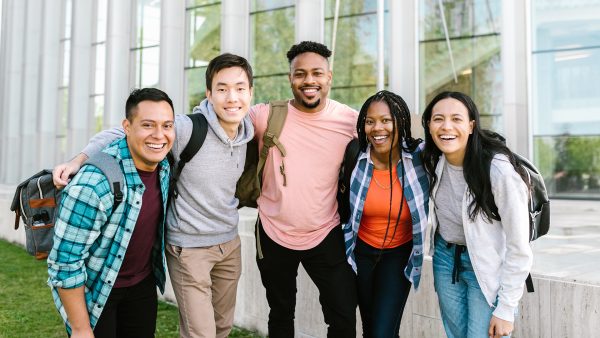 Group of college students posing on campus