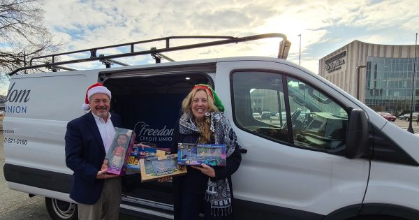 Glenn Welch and Cheryl Podgorski holding toys collected for Western Mass Toys for Tots