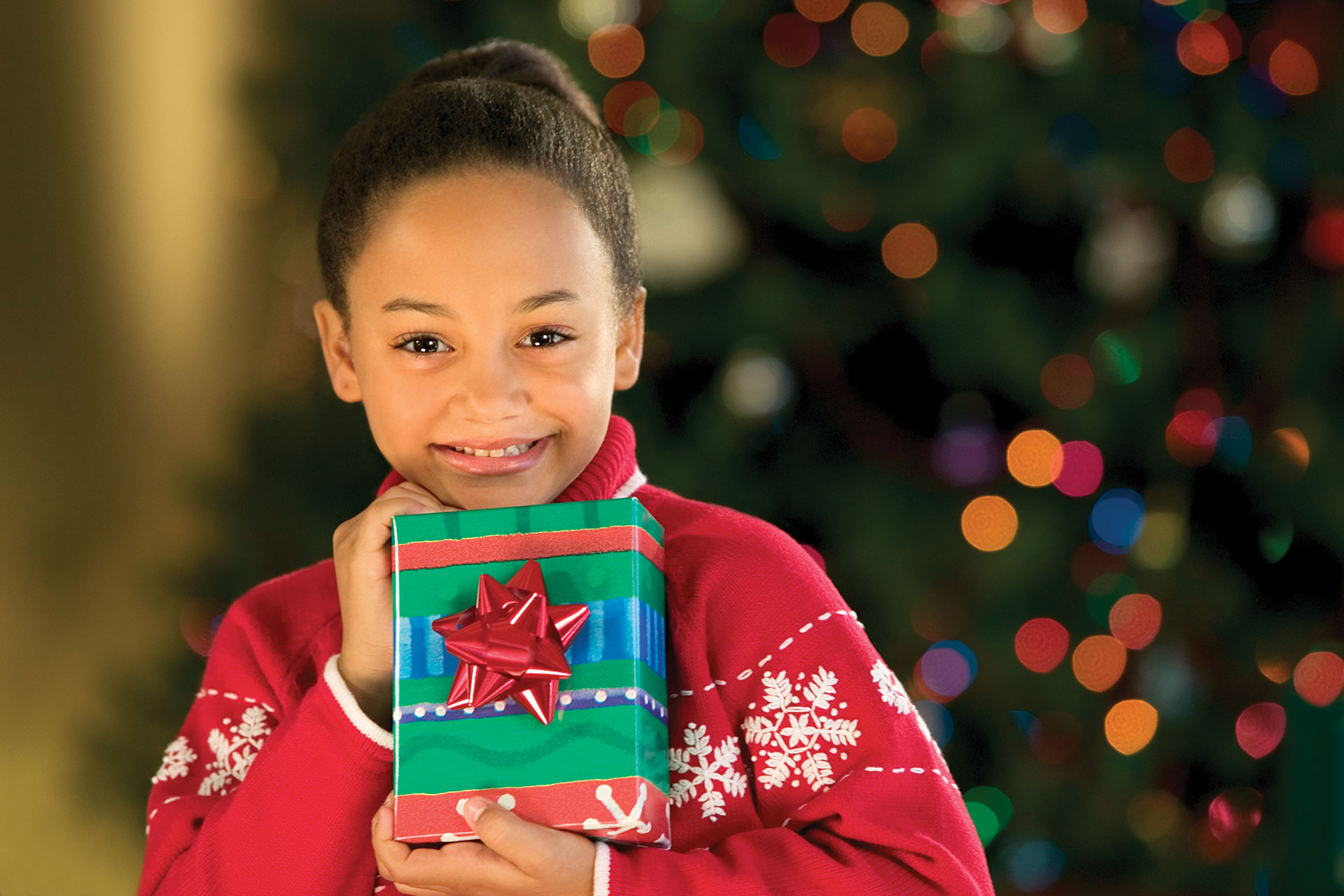 Small girl holding present