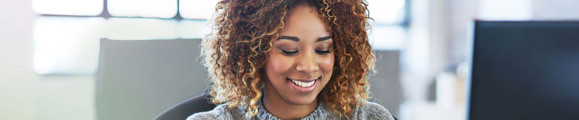 woman smiling in office