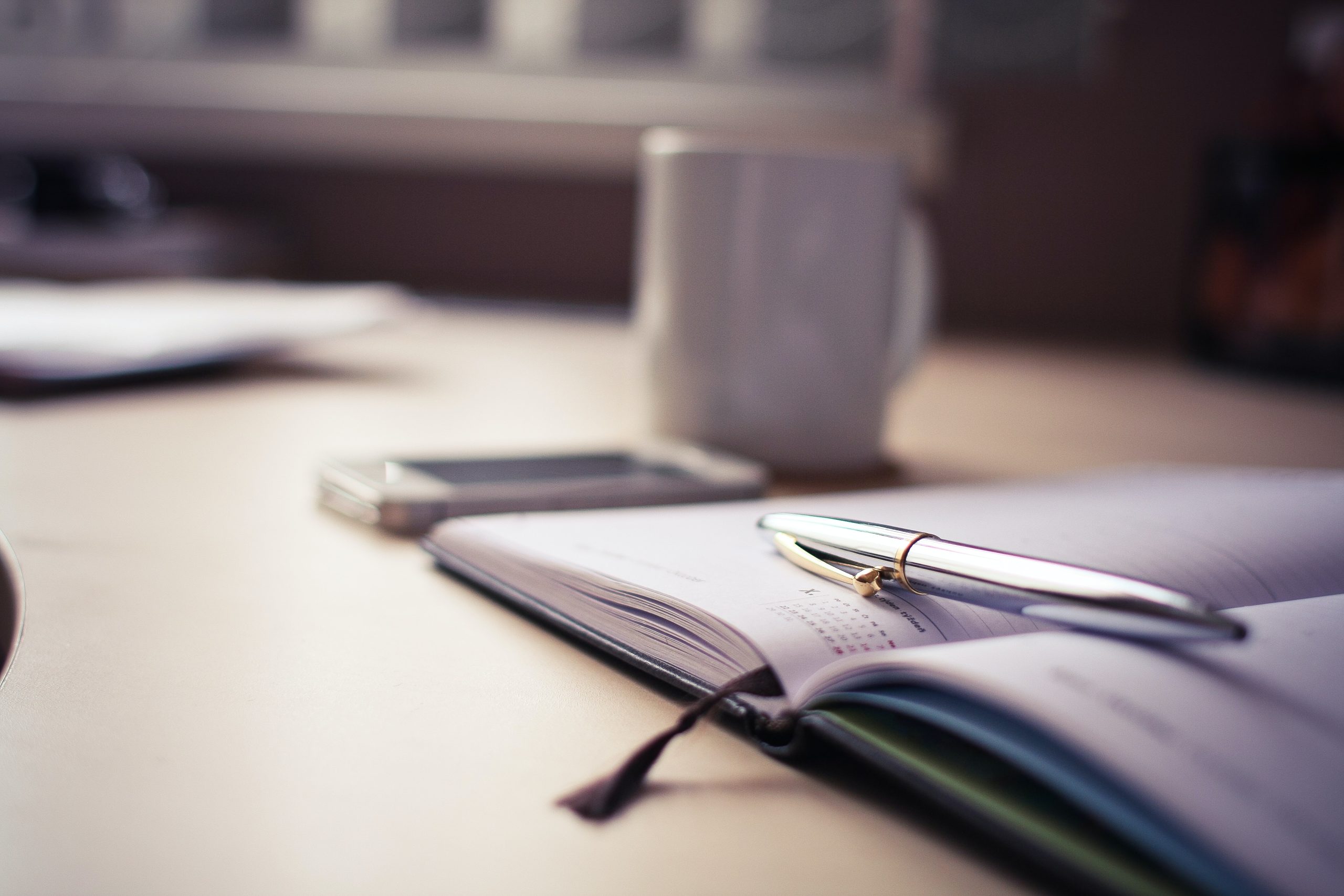 calendar and pen on a desk